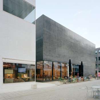 Exterior view of the Liechtenstein Art Museum with modern façade and café terrace in Vaduz.