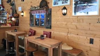 Cozy, alpine-style bar with hut flair