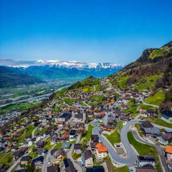 View of Vaduz with mountains and Rhine valley in the background