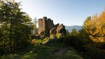 The ruins of Schalun Castle near Vaduz in Liechtenstein, impressively situated on a rocky outcrop with a view of the Alps.