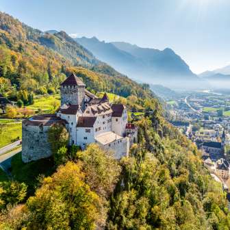 Autumnal view of Vaduz Castle in Liechtenstein with a view over the Rhine Valley