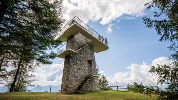 Gaflei lookout tower in Liechtenstein with stone wall, spiral staircase and platform - popular hiking destination with panoramic views.