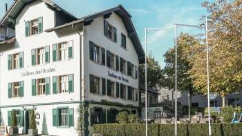 Gasthaus zum Hirschen with large outdoor area and traditional architecture