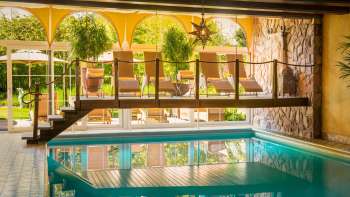 Pool area with lounge chairs at the Park Hotel Sonnenhof