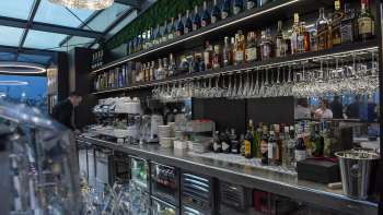 Close-up of the stylish bar in the Casino Royal Restaurant with a wide selection of drinks and modern design.