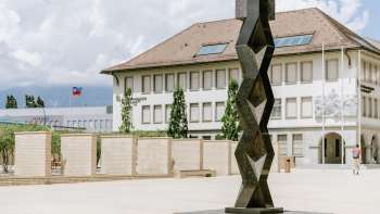 Sculpture The Prayer by Heinz Mack on Peter-Kaiser-Platz in Vaduz - abstract, vertical form made of dark metal.