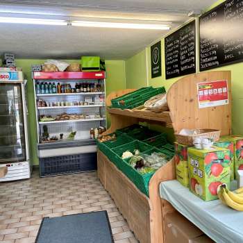  Sales room in the Aeulehof farm store with fresh vegetables, drinks and refrigerated shelves in Liechtenstein.