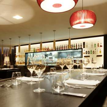 Modern bar in the Kokon restaurant with stylish wine glasses and atmospheric lighting design