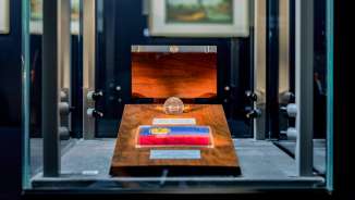 Detailed view of a presentation of the Liechtenstein national flag in a glass chamber in the TreasureChamber with a fine wooden frame