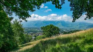 Panoramic view from the Unterländer Höhenweg over the Rhine Valley in Liechtenstein on a sunny summer's day