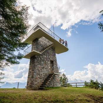Gaflei lookout tower in Liechtenstein with stone wall, spiral staircase and platform - popular hiking destination with panoramic views.