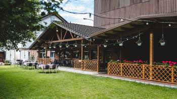 The Bangshof's spacious terrace, featuring wooden accents and a cozy atmosphere
