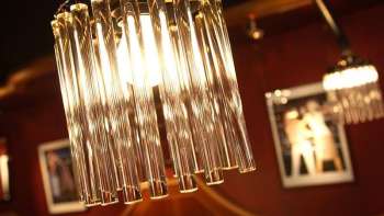 Close-up of a modern chandelier with stylish mood lighting
