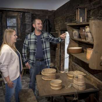 Visitors view historical everyday objects at the Walser Museum