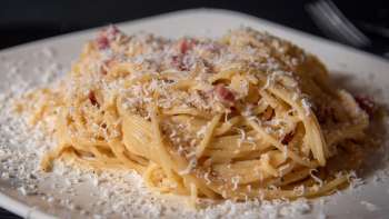 Close-up of spaghetti with Parmesan cheese