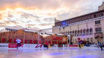 Ice skating on the colorfully illuminated ice rink of "Vaduz on Ice" on the town hall square