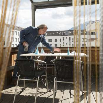 Secluded terrace area in the Made in Italy restaurant with privacy screen and city view.