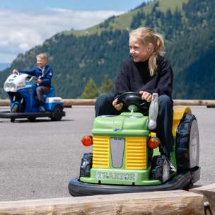 Children drive minicars