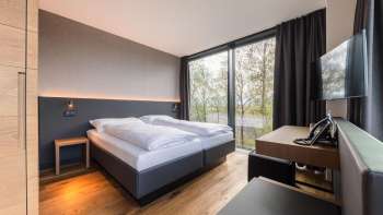Modern double room at Hotel Kommod with a view of the countryside