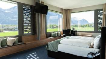 Modern double room with a view of the mountains at the Grand Casino Hotel Liechtenstein