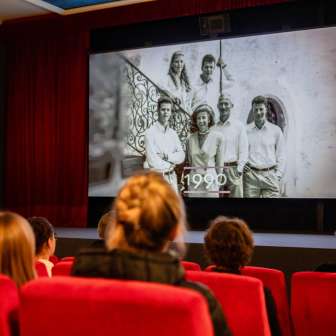 People in the historic Vaduz cinema watching a movie about Liechtenstein