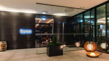 Exterior view of the bar and restaurant lounge with modern architecture and stylish entrance area.