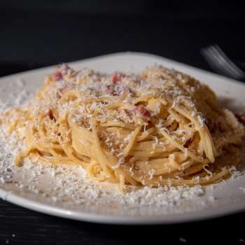 Close-up of spaghetti with Parmesan cheese
