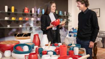 Visitors view products from the Schaedler Ceramics Workshop