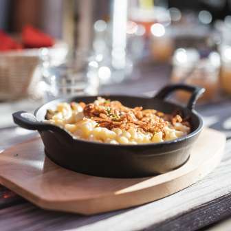 Cheese dumplings with fried onions at the Gafadura hut in Liechtenstein - regional specialty in an alpine setting