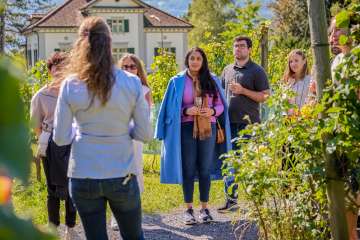 One group takes part in a guided wine tasting in the vineyards of the Court Winery in Vaduz, including a tasting of regional wines