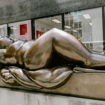 Bronze sculpture of a reclining woman in front of the Liechtenstein Art Museum in Vaduz.