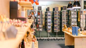 View on postcards and souvenirs in the sales area of the Liechtenstein Center in Vaduz.