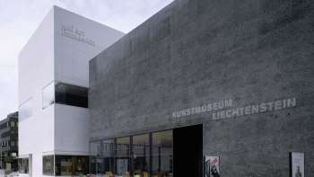 Exterior view of the modern Liechtenstein Art Museum in Vaduz with black façade