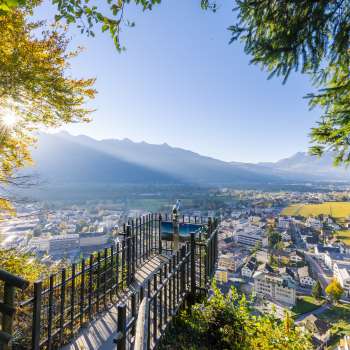 View from the panoramic terrace over the sunny Rhine Valley and the town of Vaduz.