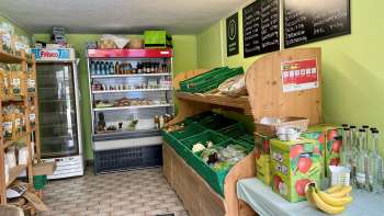  Sales room in the Aeulehof farm store with fresh vegetables, drinks and refrigerated shelves in Liechtenstein.