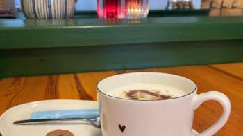 Close-up of a coffee cup on a table in the Bergstübli Steg