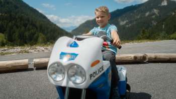 Child drives a mini-car