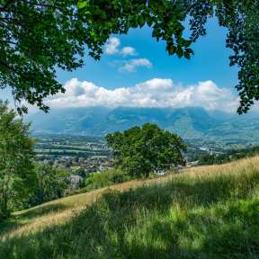Panoramic view from the Unterländer Höhenweg over the Rhine Valley in Liechtenstein on a sunny summer's day