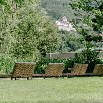 Lawn with wooden loungers with a view of Vaduz Castle