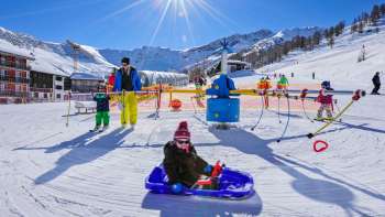 Sunny winter day in Malbi Park - fun, games and tobogganing fun for the whole family