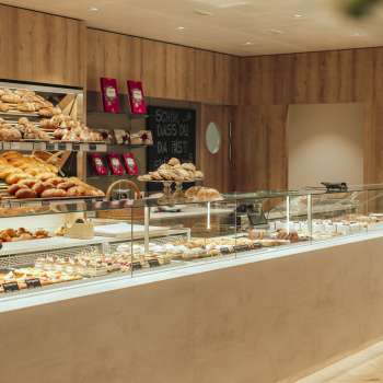 Inviting counter with a wide range of baked goods and elegant presentation