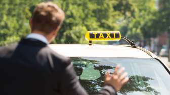 taxi-iStock.jpg Man calls a cab