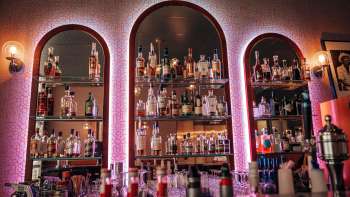 Bar shelf with a large selection of spirits