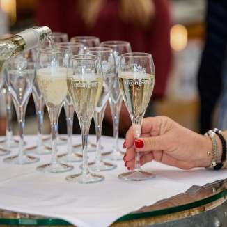During a wine tasting, sparkling Liechtenstein sparkling wine is poured into elegant glasses, close-up of a stylish pleasure experience