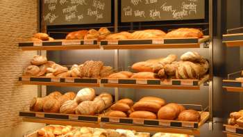 Shelf filled with breads and other delicacies in the Amann bakery and confectionery
