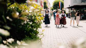 Women in traditional costumes at the 2024 national holiday in Vaduz, Liechtenstein, in sunny weather