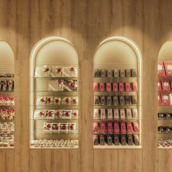 Decorative wall shelf with stylishly arranged boxes of chocolates and fine treats