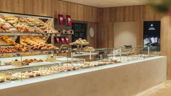 Inviting counter with a wide range of baked goods and elegant presentation