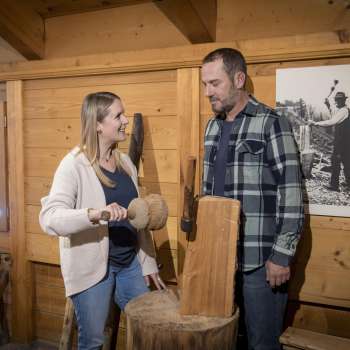 Visitors view historical everyday objects at the Walser Museum