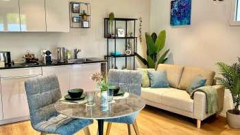 Kitchenette, dining table and sofa